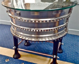 Thrust  A.totally unique titanium Jet Engine table body with Cast iron legs, hand painted internal table insert, 10mm toughened glass top steampunk buy now online