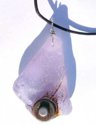 Purple seaglass steampunk pendant with a bolt or a stud of metal engrained in it, comes on a leather thong necklace. 2" x 1.5" + approx by WildAtlanticCraft steampunk buy now online