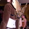 Corset and clockwork wings on a steampunk girl at Steampunk Worlds Fair steampunk buy now online