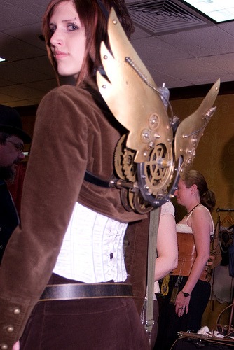 Corset and clockwork wings on a steampunk girl at Steampunk Worlds Fair steampunk buy now online