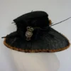 Large Upcycled Wide Brimmed Steampunk Black Hat With Bronze Ribbon Edging Large Rose And Feather Details And Large Owl Pendant With Chains by IndustriousImaginare steampunk buy now online