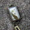 Steampunk Pendant Rectangle Wings and Lock by CreativeCompendium steampunk buy now online