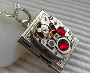 Steampunk book locket necklace with vintage watch movement and Ruby Red Swarovski crystals steampunk buy now online