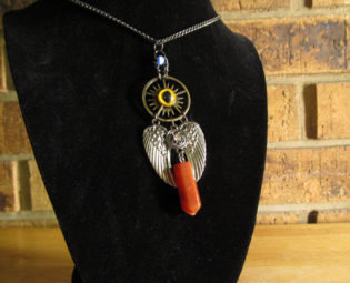 Steampunk Winged Red Quartz Necklace with yellow eye. steampunk buy now online