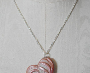 Handcrafted necklace 'Rosie Impression' featuring a sculpted pink and pearly metallic burnished heart. steampunk buy now online