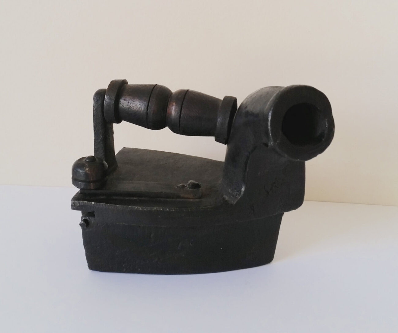 Antique collectible small miniature clothing iron cast with wooden handle dark black colour steampunk buy now online