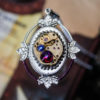 Steampunk filigree pendant with genuine vintage watch and swarovski crystals wrapped with purple metal wire. Dark gothic violet necklace by DevilsJewel steampunk buy now online
