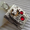 Steampunk book locket necklace with vintage watch movement and Ruby Red Swarovski crystals by Timewatch steampunk buy now online