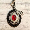 Victorian Gothic Steampunk Pendant, Black Silver and Red Necklace, Skeleton Hand, Ruby Red Cabochon, Layered Metal Pendant, Toggle Clasp by OneStopSteamShoppe steampunk buy now online