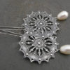 Snowflake. Filigree silver element with a white Swarovski Pearl. Feminine, elegant and festive Earrings. Long dangling earrings by Maymana steampunk buy now online