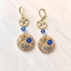 Gold-plated steampunk earrings with genuine gold watch mechanism and sapphire blue Swarovski crystal by Myriambijoux steampunk buy now online