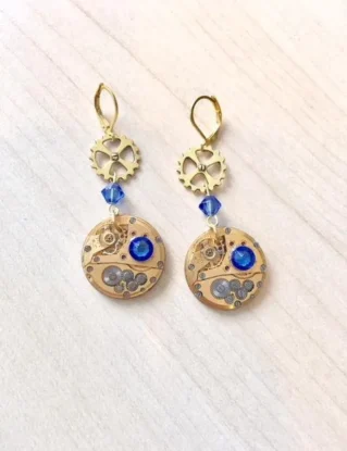 Gold-plated steampunk earrings with genuine gold watch mechanism and sapphire blue Swarovski crystal by Myriambijoux steampunk buy now online