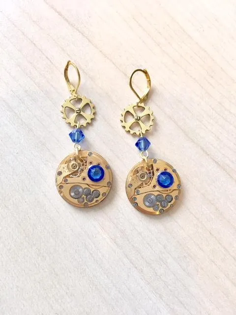 Gold-plated steampunk earrings with genuine gold watch mechanism and sapphire blue Swarovski crystal by Myriambijoux steampunk buy now online Gold-plated steampunk earrings with genuine gold watch mechanism and sapphire blue Swarovski crystal by Myriambijoux steampunk buy now online