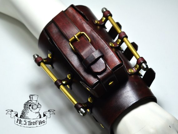 A little bigger steampunk explorer's bracer. With brass protecton bars and useful pocket. by TimmyHog steampunk buy now online