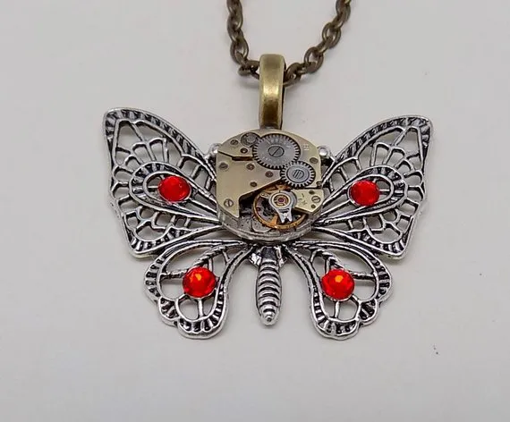 Steampunk butterfly pendant necklace with a vintage watch.Steampunk jewelry by slotzkin steampunk buy now online Steampunk butterfly pendant necklace with a vintage watch.Steampunk jewelry by slotzkin steampunk buy now online