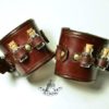 A pair of bracelets with little bottles by TimmyHog steampunk buy now online