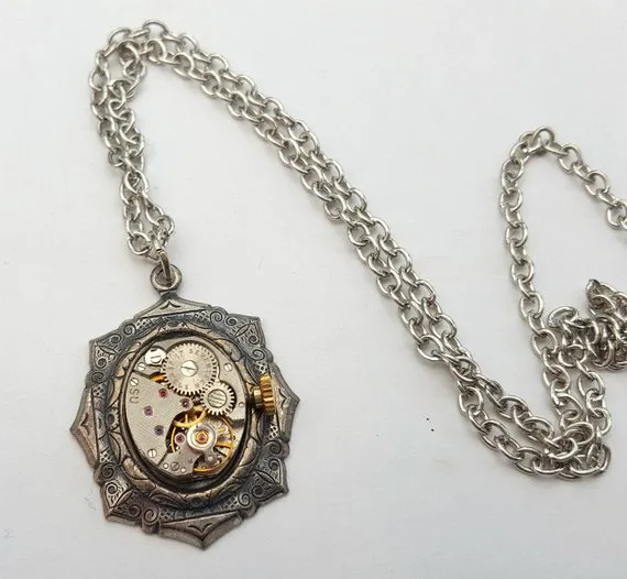 Steampunk necklace, vintage watch movement in antique silver setting on antique silver chain by PirateTreasures steampunk buy now online Steampunk necklace, vintage watch movement in antique silver setting on antique silver chain by PirateTreasures steampunk buy now online