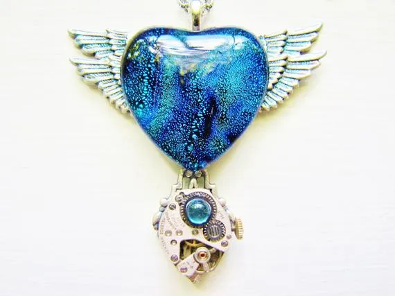 Steampunk Double Winged Rich Blue Dichroic Glass Heart Pendant Necklace With Vintage Watch Movement, Steampunk Necklace, Winged Heart HTN6 by RavensSecretStash steampunk buy now online Steampunk Double Winged Rich Blue Dichroic Glass Heart Pendant Necklace With Vintage Watch Movement, Steampunk Necklace, Winged Heart HTN6 by RavensSecretStash steampunk buy now online