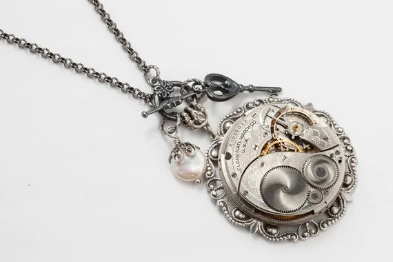 Steampunk Necklace with Vintage Elgin Pocket Watch Movement, Genuine Pearl, Silver Filigree & Skeleton Key Charm, Victorian Jewerly Gift by steampunknation steampunk buy now online Steampunk Necklace with Vintage Elgin Pocket Watch Movement, Genuine Pearl, Silver Filigree & Skeleton Key Charm, Victorian Jewerly Gift by steampunknation steampunk buy now online