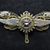Steampunk Winged Bronze Dragonfly Pin Badge Brooch featuring gold, copper, and silver cogs & gears, and silver wings by KindHeartsEmporium steampunk buy now online Steampunk Winged Bronze Dragonfly Pin Badge Brooch featuring gold, copper, and silver cogs & gears, and silver wings by KindHeartsEmporium steampunk buy now online