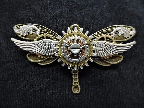 Steampunk Winged Bronze Dragonfly Pin Badge Brooch featuring gold, copper, and silver cogs & gears, and silver wings by KindHeartsEmporium steampunk buy now online Steampunk Winged Bronze Dragonfly Pin Badge Brooch featuring gold, copper, and silver cogs & gears, and silver wings by KindHeartsEmporium steampunk buy now online