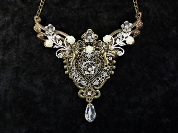 Gorgeous Steampunk jewelry - Romantic handmade bib necklace in bronze and silver tones with heart, cherubs, flowers & crystal drop by KindHeartsEmporium steampunk buy now online